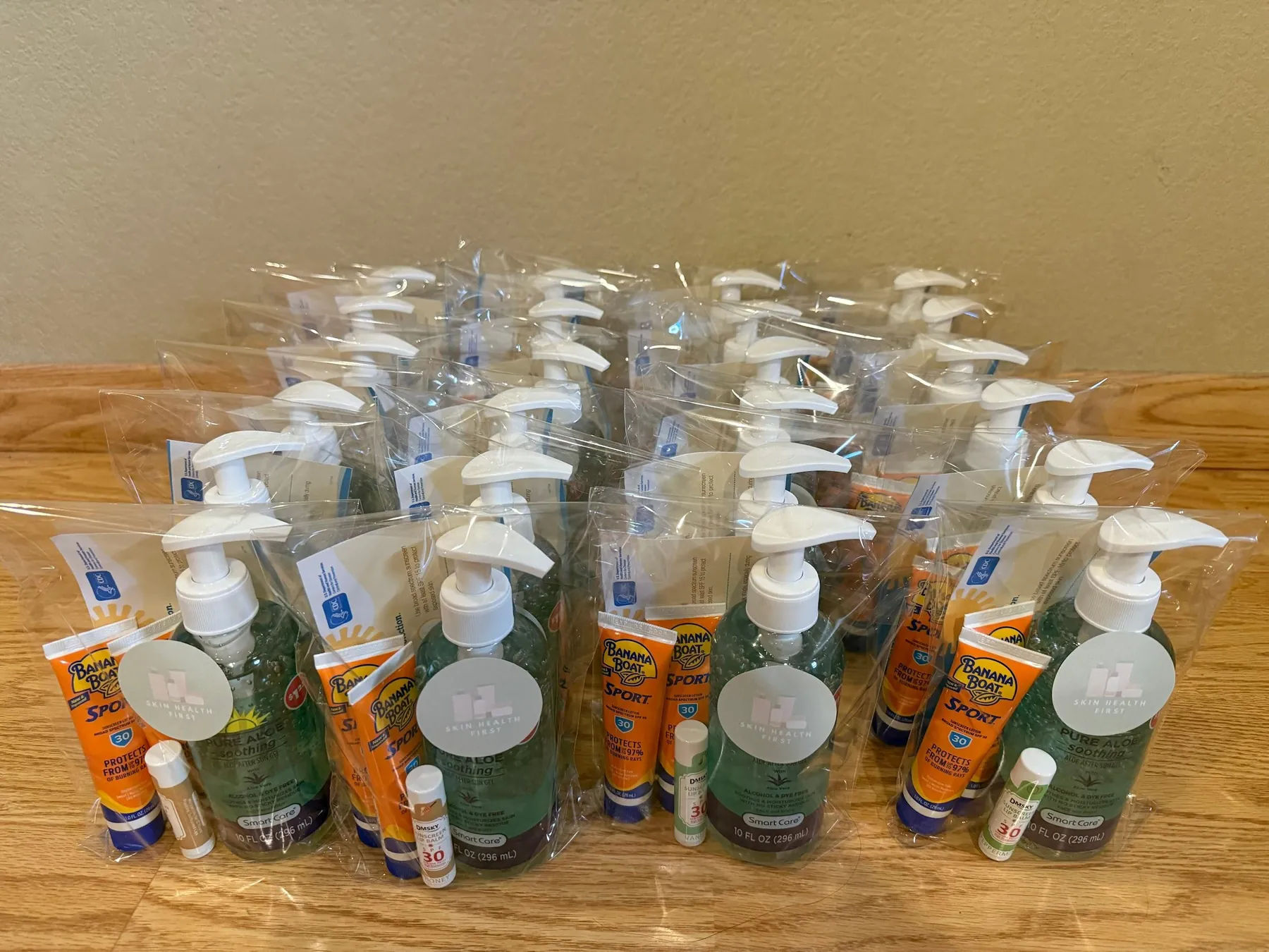 Assembled skincare kits with Skin Health First labels.